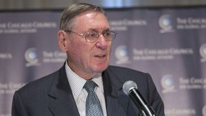 Lester Crown speaks into a microphone