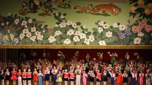 Children from North Korea's elite performing arts school wave to the audience in the North Korean capital of Pyongyang