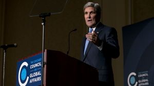 John Kerry speaking at a podium