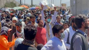 Afghans show documents to US troops in Kabul