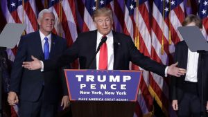 Front view of President elect Trump saluting a crowd after winning the 2016 US elections