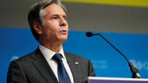 Secretary of State Antony Blinken at a podium at the Organization for Economic Cooperation and Development's Ministerial Council Meeting on Oct. 5, 2021, in Paris.