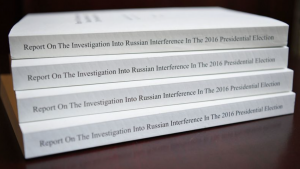 Stacks of books with Report on the Investigation Into Russian Interference in the 2016 Presidential Election on the spine