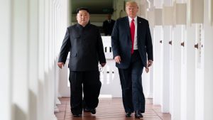 President Donald J. Trump walks with North Korean leader Kim Jong Un