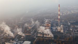 An aerial view of smoke coming out a factory