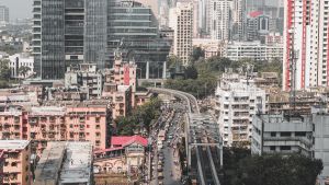 Aerial view of a busy street and a building under construction in Mumbai