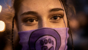 A woman attends a rally to mark International Women's Day in Madrid, Friday, March 8, 2019.