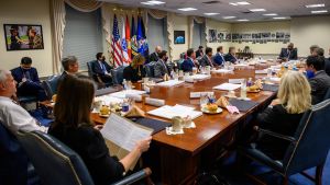 Secretary of Defense, Lloyd Austin, sits at a table with Congress to discuss China's pacing.