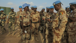 French and Chadian peacekeepers talk at the Minusma peacekeeping base in Kidal, Mali