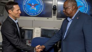 Secretary of Defense, Lloyd J. Austin III administers the oath of office to Dr. Ely Ratner.