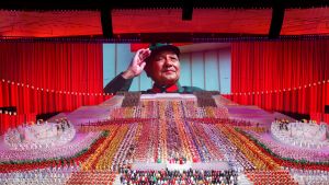  A screen shows late Chinese leader Deng Xiaoping during a show commemorating the 100th anniversary of the founding of the Communist Party of China