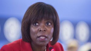 Ertharin Cousin speaking into a microphone