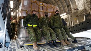 Canadian Forces personnel load lethal and non-lethal aid to be sent to Ukraine