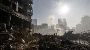Destruction shown before a city skyline in Kyiv. 