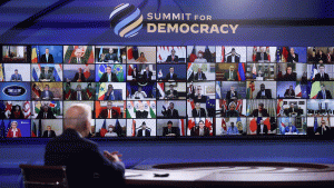 President Biden views the virtual Summit for Democracy attendees on screen.