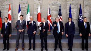 World leaders standing in front of flags