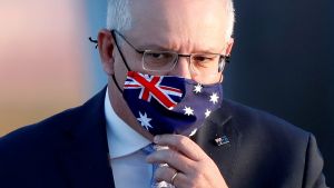 Australian Prime Minister Scott Morrison in a mask with a flag on it