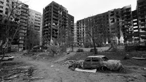 Black and white shot of destroyed city street in Ukraine.
