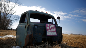A truck part with a "for sale" sign sits on the ground in Marshalltown, Iowa, March 8, 2015.