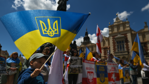 Protesters at the 'NATO Close The Sky' Protest In Krakow, Poland on May 29, 2022.