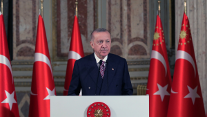 Turkish President Recep Tayyip Erdogan stands at a podium.