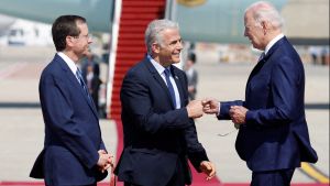 Biden bumps fists with Israeli leaders on the tarmac in the Middle East. 