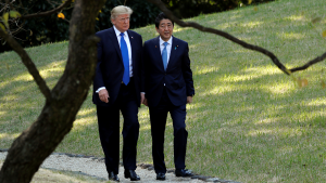 U.S. President Donald Trump and Japan's Prime Minister Shinzo Abe walk together at the Akasaka Palace in Tokyo on November 6, 2017.