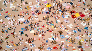 An overhead view of a crowd of beachgoers at Oak Street Beach.