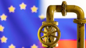 Illustration shows natural gas pipeline in front of word EU and Russia flag colors