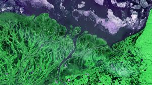 Satellite images of a river valley and ice melting 