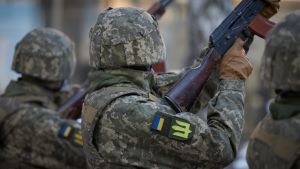 Ukrainian troops raise guns in the air