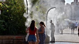 People cooling during city heat wave.