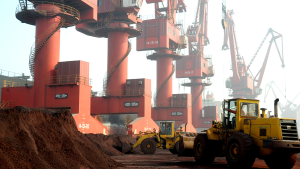 Workers transport soil containing rare earth elements for export at a port in Lianyungang, China.