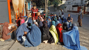 Afghans waiting for a piece of bread