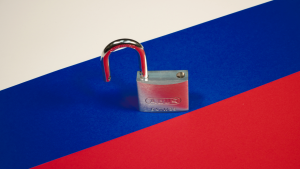 padlock on white, red, and blue stripes, via unsplash. 
