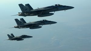 A formation of U.S. Navy F-18E Super Hornet aircraft leaves after receiving fuel from an Air Force KC-135 Stratotanker aircraft over northern Iraq after conducting air strikes in Syria Sept. 23, 2014.