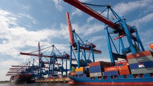 a cargo ship stacked with shipping containers