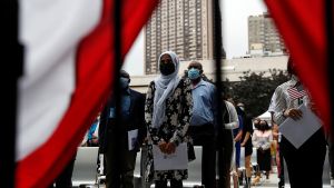 Citizenship candidates stand for a naturalization ceremony in New York City