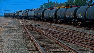 A train carrying many cars of oil containers