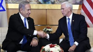 Benjamin Netanyahu and Mike Pence shake hands