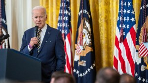 President Joe Biden speaks at a lecturn