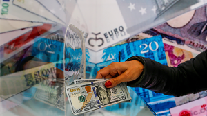 A money changer sells US dollar bills at a currency exchange office located in Ankara, Turkey