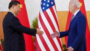 Xi Jinping and Joe Biden shake hands