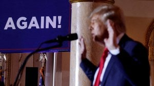 Donald Trump speaks at a microphone
