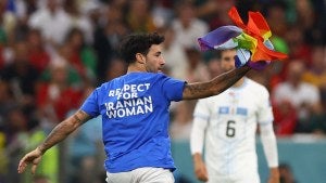 A pitch invader disrupts Portugal v. Uruguay at the Qatar World Cup