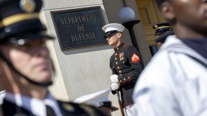 a soldier stands outside the Department of Defense
