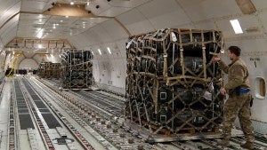 Military equipment bound for Ukraine are loaded on a plane