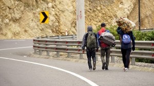 Venezuelans migrants carry their belongings as they try to reach Peru
