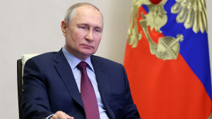 Russian President Vladimir Putin sits at a desk on February 15, 2023.