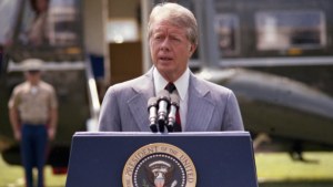 Jimmy Carter speaks at a lecturn